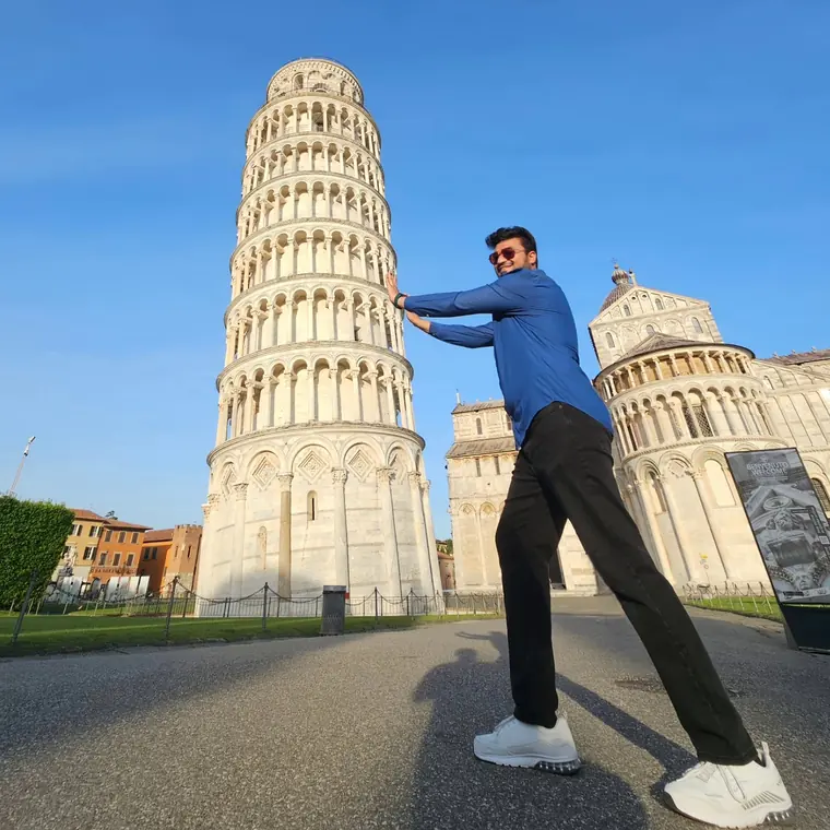 Sandeep doing the classic pose, pretending to hold up the Leaning Tower of Pisa